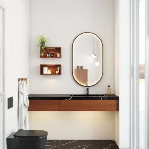 Moderne og stilfull baderomsinspirasjon med ovalt speil med svart ramme og lysstyring, farget toalett, servantskap, underskap og skap i rødbrun eik, Silestone servant og matchende gulv